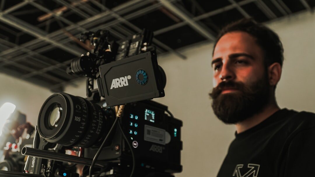 Studio portrait of an Italian man with beard, broadcast director instructor