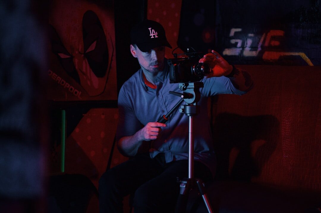 Director switching cameras at a multi-screen live broadcast control room