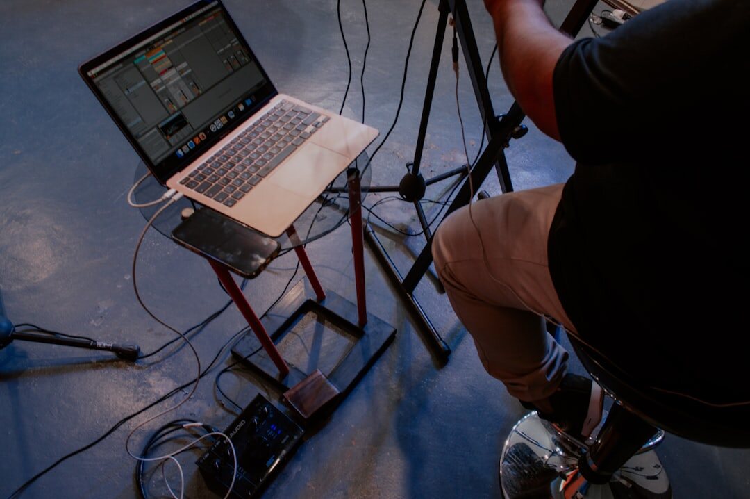 Streaming operator managing a live broadcast on laptop and encoder hardware